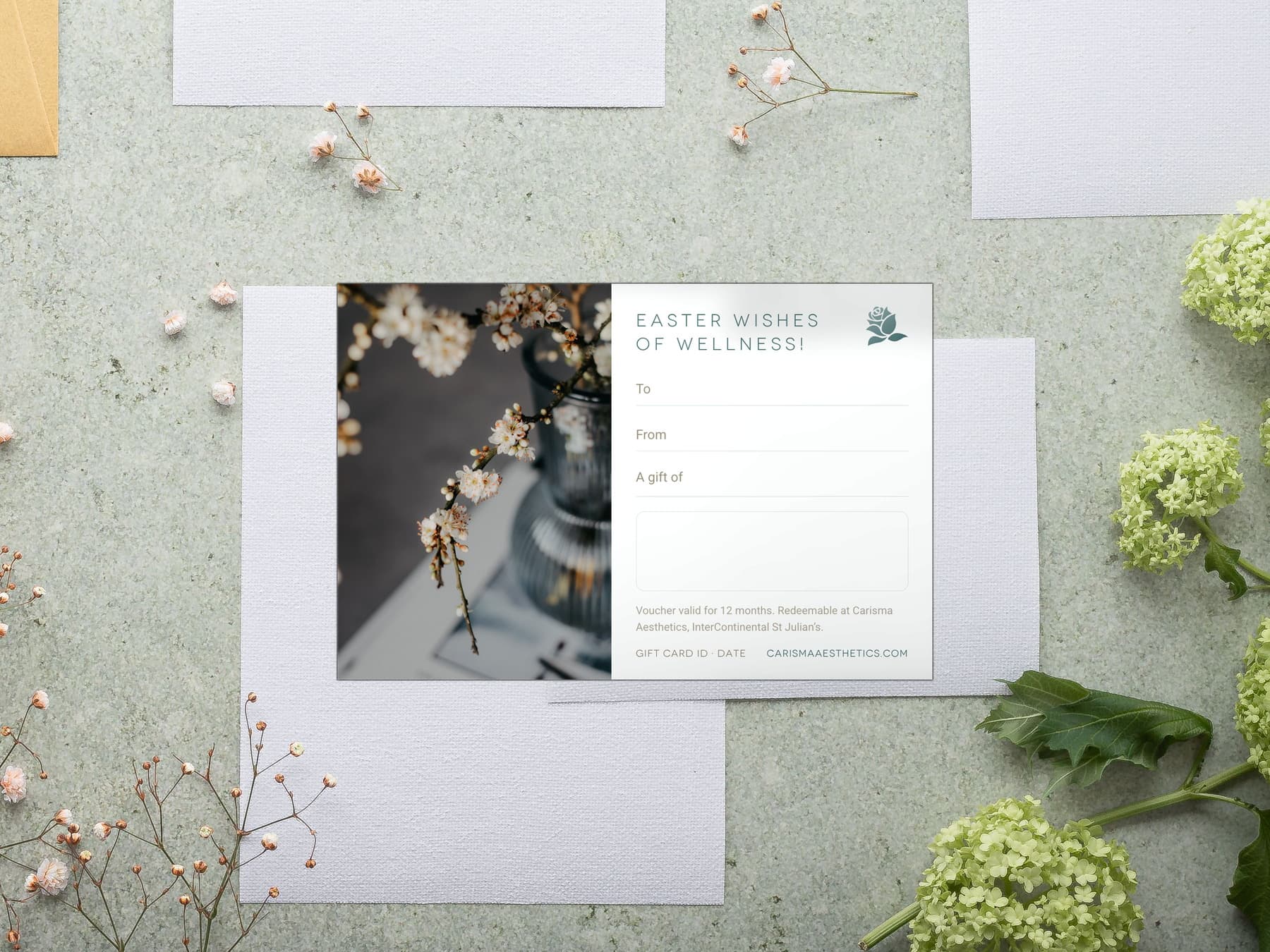 A Carisma Aesthetics Easter gift card with spring blossom on white plaster — Easter gift cards at Carisma Aesthetics Malta