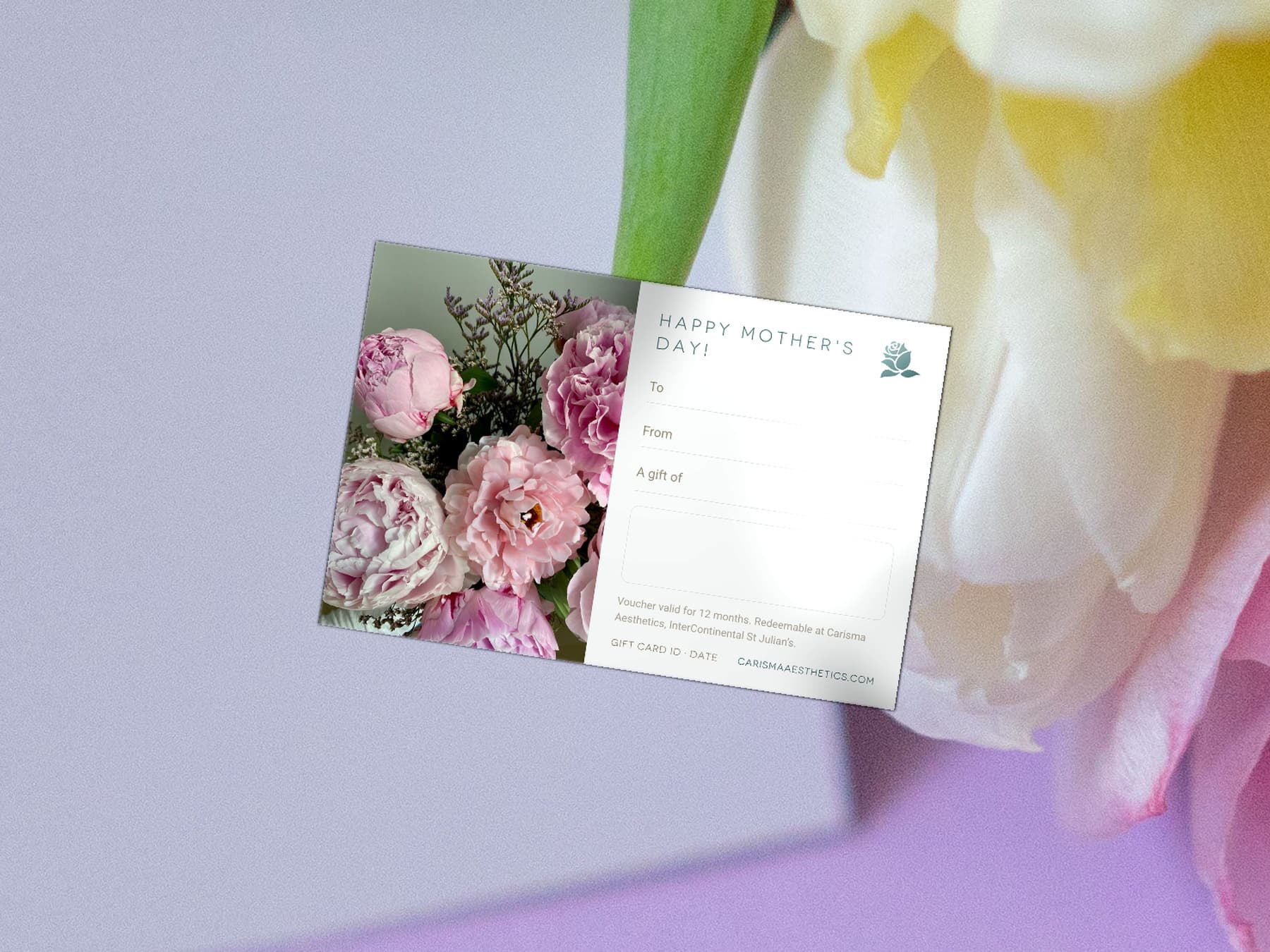A Carisma Aesthetics Mother's Day gift card on pale stone with cream roses and gypsophila — Mother's Day gift cards at Carisma Aesthetics Malta