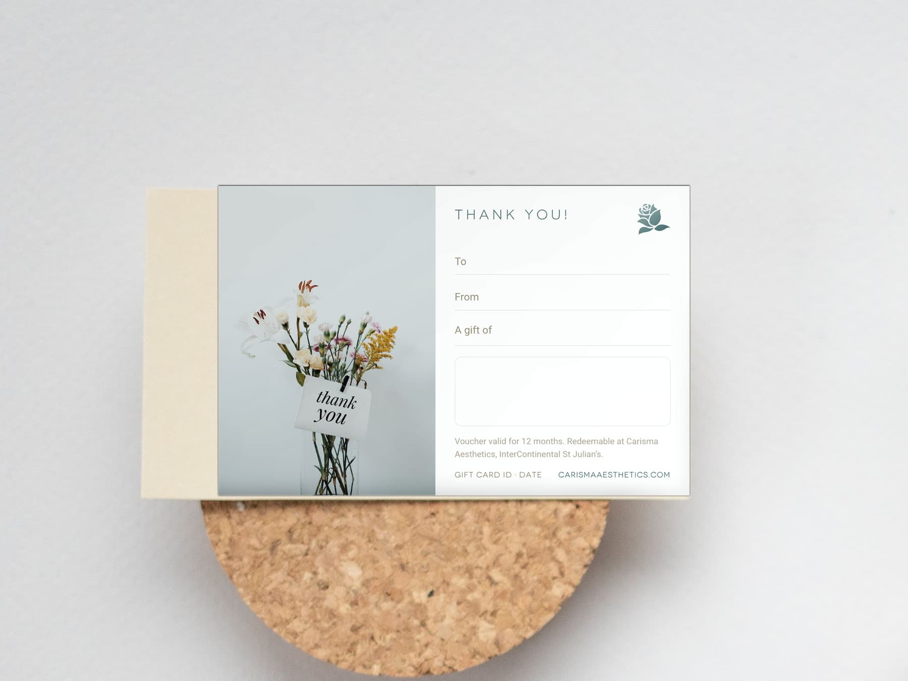 A Carisma Aesthetics thank-you gift card on a pale ceramic plate — Thank You gift cards at Carisma Aesthetics Malta